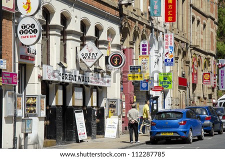 MANCHESTER, ENGLAND - MAY 25: Faulkner Street in Chinatown on May 25, 2012 in Manchester, England. Manchester\'s Chinatown is the 2nd largest Chinatown in the UK and the 3rd largest in Europe.
