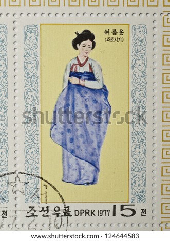 NORTH KOREA - CIRCA 1977: a stamp from North Korea shows image of a woman in traditional North Korean costume, circa 1977