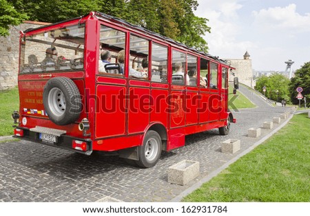 BRATISLAVA, SLOVAKIA - JUNE 7: a sightseeing tour bus on June 7, 2013 in Bratislava, Slovakia. Bratislava is the capital of Slovakia and has a population of 460,000.