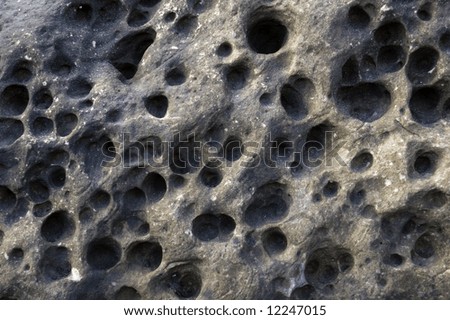 Pattern of holes on rock