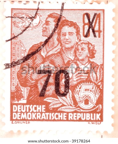 EAST GERMANY - CIRCA 1951: A stamp printed in East Germany shows image of a family, series, circa 1951