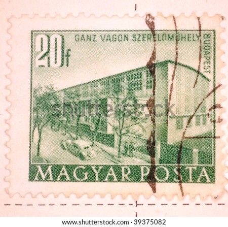 HUNGARY - CIRCA 1958: A stamp printed in Hungary shows image of the headquarters of the company Ganz Vagon, series, circa 1958