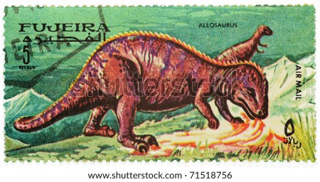 FUJEIRA - CIRCA 1968: a stamp from Fujeira from the dinosaurs series shows image of an allosaurus, circa 1968