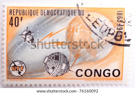 DEMOCRATIC REPUBLIC OF CONGO - CIRCA 1965: a stamp from the Democratic Republic of Congo shows image of the Earth and satellites, circa 1965