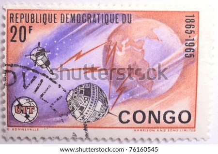 DEMOCRATIC REPUBLIC OF CONGO - CIRCA 1965: a 20 franc stamp from the Democratic Republic of Congo shows image of the Earth and satellites, circa 1965