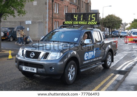 EDINBURGH - MAY 22: The lead vehicle indicates the time of the lead runners in the Edinburgh Marathon on May 22, 2011 in Edinburgh, Scotland. The event is the biggest of its kind in Scotland.