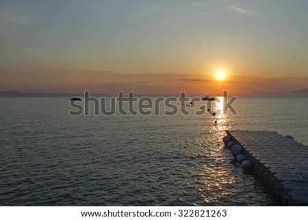 sunrise on aegean sea, sunrise on the Aegean Sea, sunrise over the pier on the Aegean Sea, morning at the sea berth, sunrise on the Sea