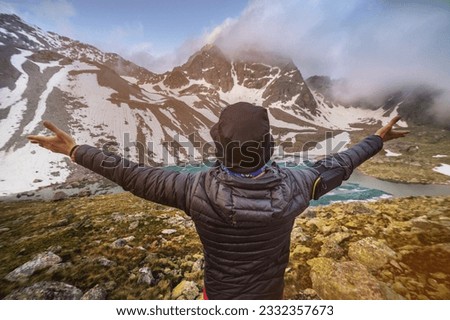 Similar – Image, Stock Photo Unrecognizable tourist admiring mountain and forest
