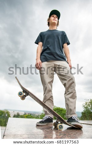 Similar – Image, Stock Photo Young bearded skater standing on ramp in skatepark