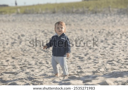 Similar – Foto Bild Spaziergänger mit Brandung am Strand von Sao Pedro de Moel in Portugal