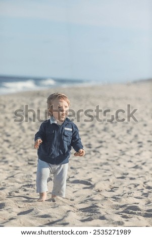 Similar – Foto Bild Spaziergänger mit Brandung am Strand von Sao Pedro de Moel in Portugal