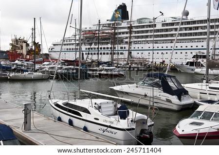 KLAIPEDA,LITHUANIA- JUNE 27:Sailing boats and cruise liner in the harbor at summer on June 27,2012 in Klaipeda,Lithuania.is the third largest city in Lithuania and the capital of Klaipeda County.