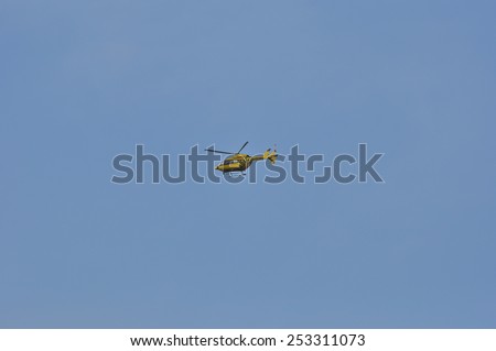 MAINZ,GERMANY-FEB 14:ADAC helicopter in the blue sky on February 14,2015 in Mainz,Germany.ADAC is an automobile club in Germany, founded in 1903 as German Motorbiker Association.