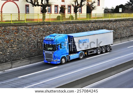 MAINZ,GERMANY-FEB 20:SCANIA blue  truck on the highway on February 20,2015 in Mainz,Germany.Scania, is a major Swedish automotive industry manufacturer of specifically heavy trucks and buses.