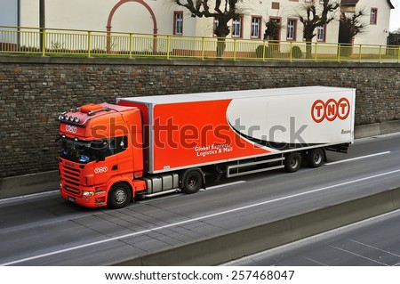 MAINZ, GERMANY - FEB 20: TNT delivery truck on the highway on February 20,2015 in Mainz, Germany.TNT is an international courier delivery services company with headquarters in Hoofddorp, Netherlands.