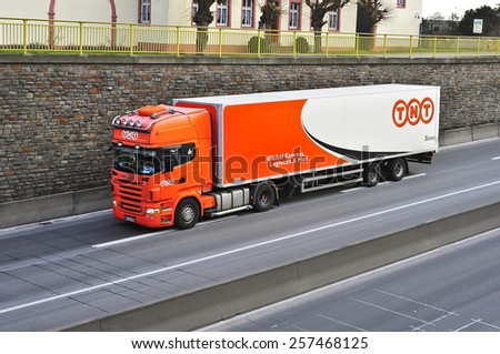 MAINZ, GERMANY - FEB 20: TNT delivery truck on the highway on February 20,2015 in Mainz, Germany.TNT is an international courier delivery services company with headquarters in Hoofddorp, Netherlands.