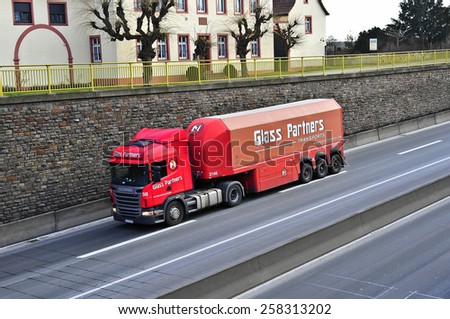 MAINZ,GERMANY-FEB 20:SCANIA white oil truck on the highway on February 20,2015 in Mainz,Germany.Scania, is a major Swedish automotive industry manufacturer of specifically heavy trucks and buses.