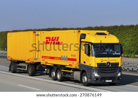 FRANKFURT,GERMANY - APRIL 10: DHL delivery truck on the highway on April 10,2015 in Frankfurt, Germany. DHL is a world wide courier company that operates in 220 countries with over 285,000 employees.