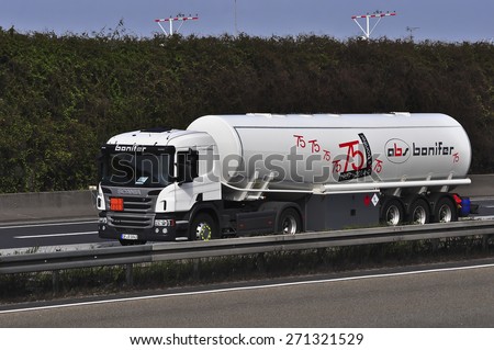FRANKFURT,GERMANY-MARCH 28:Scania oil truck on the highway on March 28,2015 in Frankfurt,Germany.Scania, is a major Swedish automotive industry manufacturer of specifically heavy trucks and buses.
