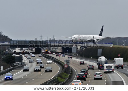 FRANKFURT,GERMANY-MARCH 28:airplane of Air China over highway A3 in Frankfurt,Germany.Air China Limited is the flag carrier and one of the major airlines of the People\'s Republic of China.