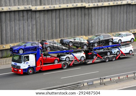 FRANKFURT,GERMANY-APRIL 16:MERCEDES BENZ  truck with FORD cars on the highway on April 16,2015 in Frankfurt,Germany