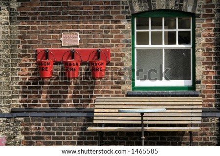 fire buckets bench and window at a railway station museum