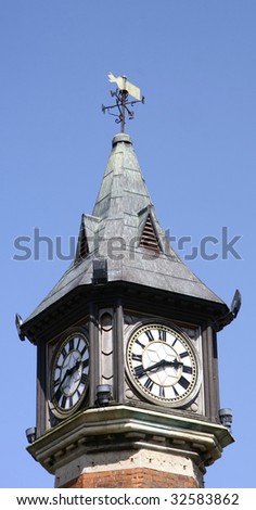 top of a clock tower showing two faces