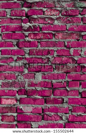 Multicolored brickwork background that based on the brick wall of rough colored bricks.