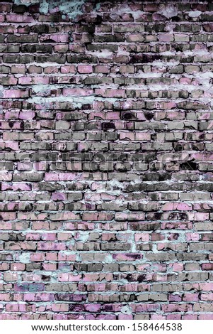 Background and texture on the basis of a brick wall of the rustic colored bricks.