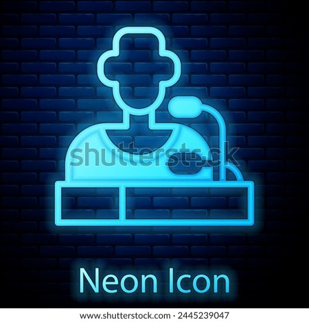 Glowing neon Football player press conference icon isolated on brick wall background.  Vector