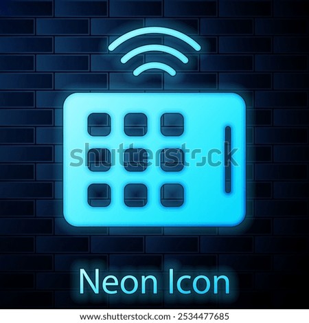 Glowing neon Wireless tablet icon isolated on brick wall background. Internet of things concept with wireless connection.  Vector