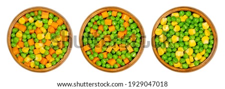 Mixed vegetables in wooden bowls. Three mixes of green peas, corn and carrot cubes. Mix of peas, carrots cut in cubes and vegetable maize, also called sugar or pole corn. Close up, macro, food photo.