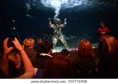 VANCOUVER, CANADA - JANUARY 18, 2015: A diver swims in a shark tank during annual Diver's Weekend at Vancouver Aquarium in Vancouver, Canada, on January 18, 2015.