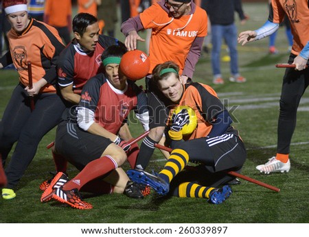 VANCOUVER, CANADA - NOVEMBER 22, 2014: University teams play quidditch, the game of Harry Potter books fame, at Simon Fraser University in Burnaby, BC, Canada, on November 22, 2014.