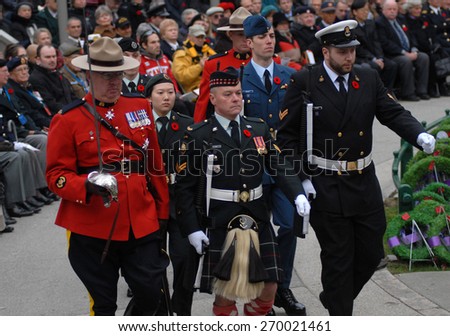 VANCOUVER, CANADA - NOVEMBER 11, 2013: Canadian veterans and military personnel take part in Remembrance Day ceremony and parade at the Victory Square in Vancouver, Canada, on November 11, 2013.