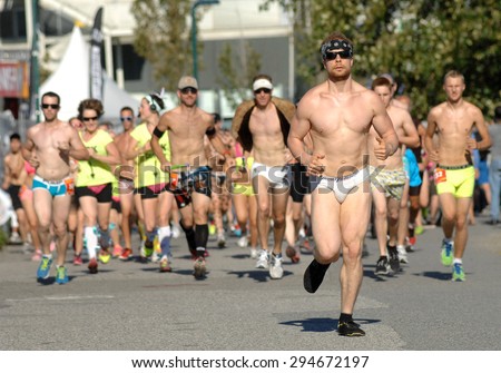 VANCOUVER, CANADA - JULY 7, 2013: People take part in the BC Cancer Foundation\'s 2013 Underwear Affair 10km run to raise funds for cancer research in Vancouver, Canada, July 7, 2013.