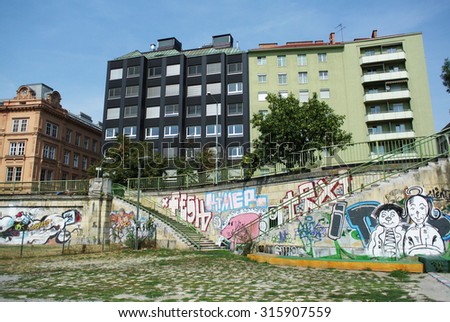 VIENNA, AUSTRIA - AUGUST 25, 2013: Colorful graffiti art murals line the streets and banks of the Danube River and its canals in Vienna, Austria, August 25, 2013.