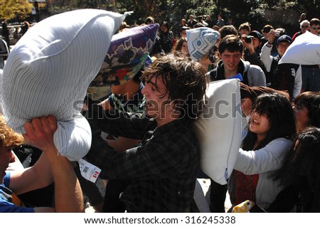 VANCOUVER, CANADA - APRIL 7, 2012: Feathers went flying as hundreds of people came armed with their pillows to celebrate the International Pillow Fight Day 2012 in Vancouver, Canada, April 07, 2012.