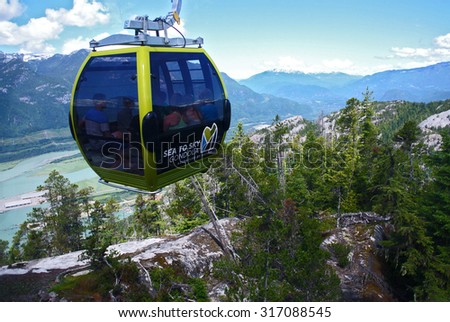 SQUAMISH, CANADA - JULY 7, 2014: People ascend to the top of new 885-metre Sea-to-Sky Gondola attraction for the majestic views of Howe Sound in Squamish, BC, Canada, July 7, 2014.