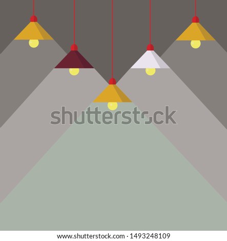 A few burning lamps hanging from the ceiling on a gray background
