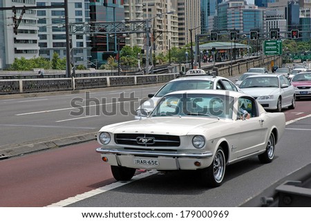 SYDNEY, AUSTRALIA- CIRCA  DECEMBER 2004. 2014 is the 50th anniversary for the Ford Mustang. The new model will be the first built with a right-hand drive option. 1965 model is shown on its 40th anniversary. Sydney
