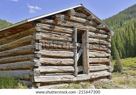 Log cabin in mining town, western USA