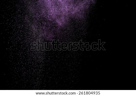 Abstract purple  paint Holi. Abstract purple powder explosion on black background.
