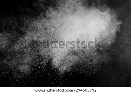 abstract white dust explosion  on black background. abstract white powder explosion  on black background