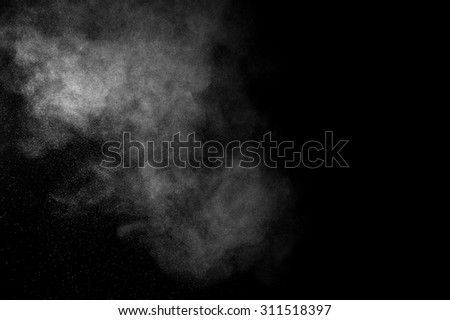 abstract white dust explosion  on a black background. abstract white powder. design elements. abstract texture.