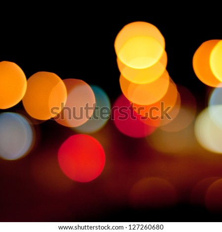 Blurred defocused lights background of city at night. Bokeh sparkling lights.