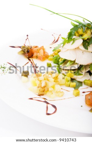 Plate with meat, greens, corn, pineapples, nuts and sauce on white background.