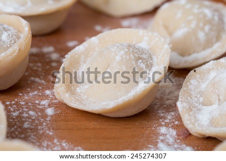 Homemade raw pastry dumplings with meat filling called pelmeni