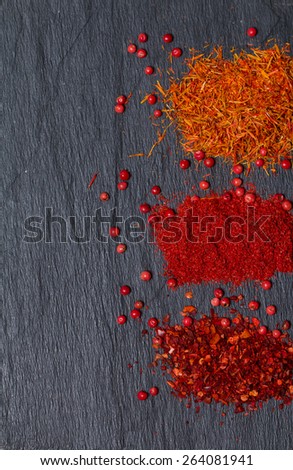 Set of three hot red spices on black background