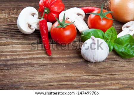 Small edge of vegetables and herbs on old wood
